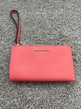 Michael Kors Coral Pink Wristlet with Gold Logo